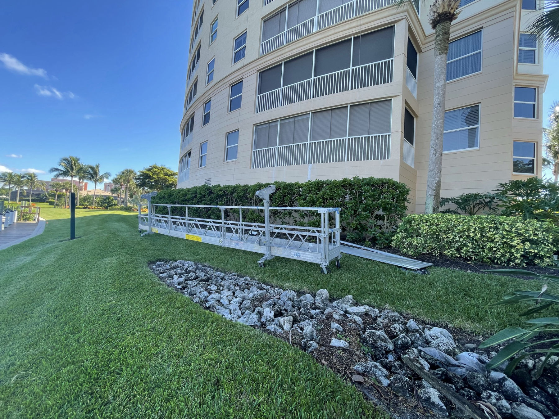 Swing-stage staging at Harbour Isles condominiums in Fort Myers for MORA envelope waterproofing