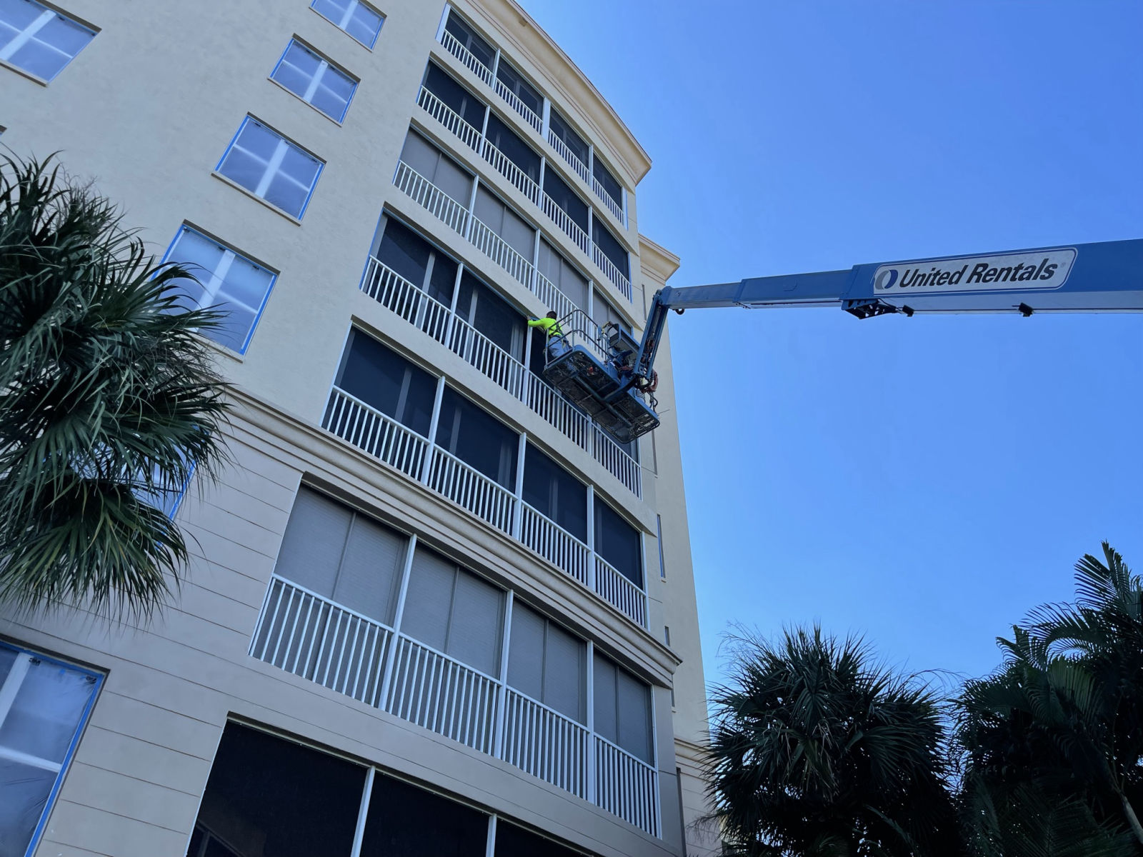 MORA crew working from a swing stage at Harbour Isles condominiums, Fort Myers FL