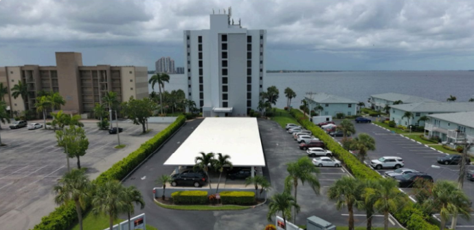 High-rise condominium tower on the Caloosahatchee River in Fort Myers, Florida — building envelope protection by MORA
